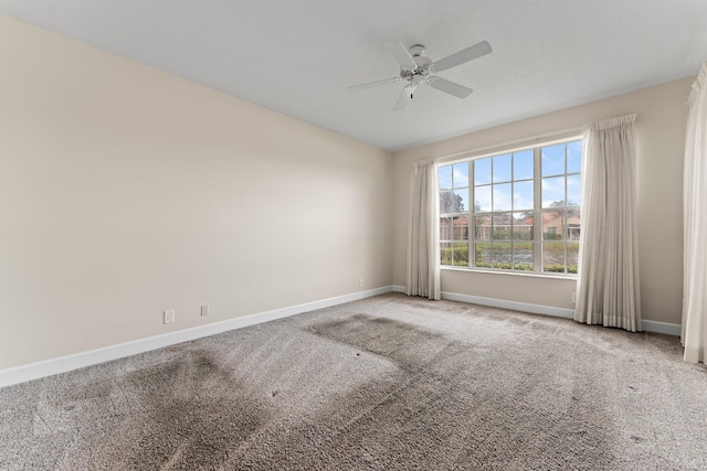 carpeted empty room with ceiling fan