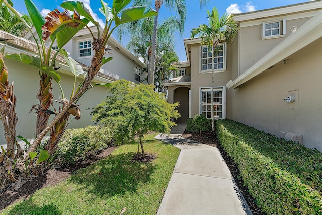 entrance to property with a yard