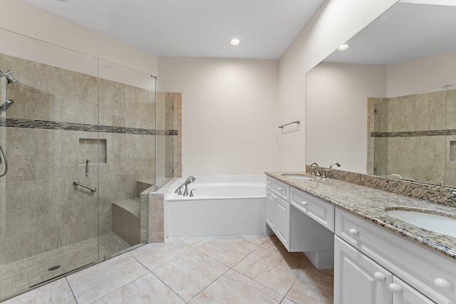 bathroom featuring independent shower and bath and vanity