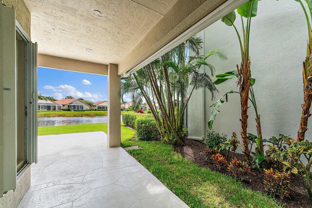 view of patio / terrace with a water view