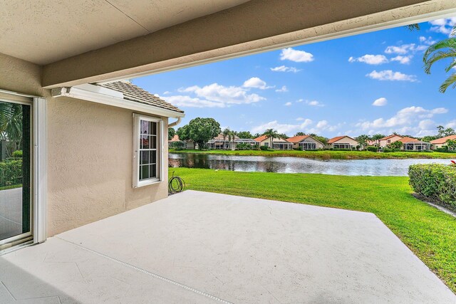 view of patio featuring a water view