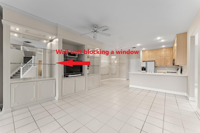 interior space featuring light tile patterned floors and ceiling fan