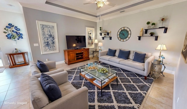 tiled living room featuring ceiling fan and crown molding