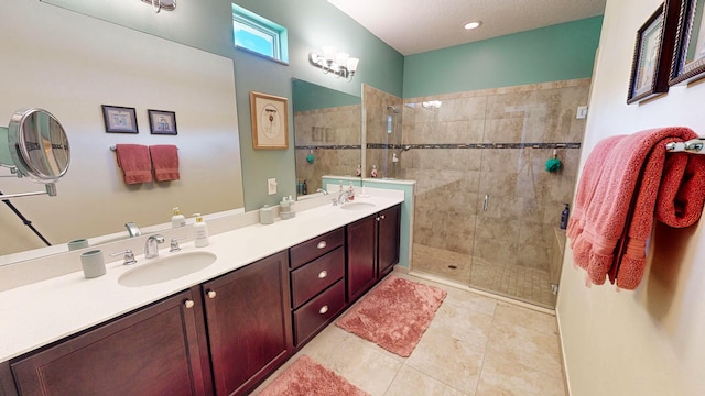 bathroom featuring tile patterned floors, vanity, and an enclosed shower