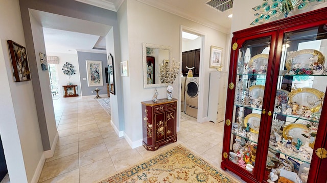 corridor featuring light tile patterned floors and crown molding