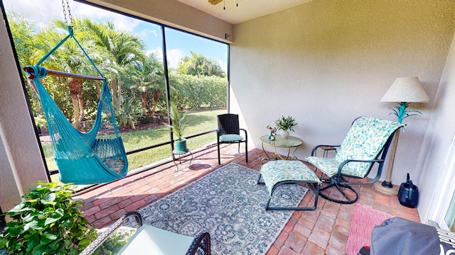 sunroom / solarium with ceiling fan