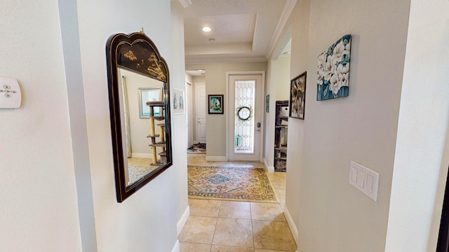 hall with light tile patterned floors and a textured ceiling