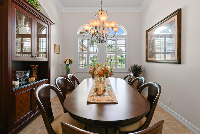 dining area with a notable chandelier, light tile patterned floors, and crown molding