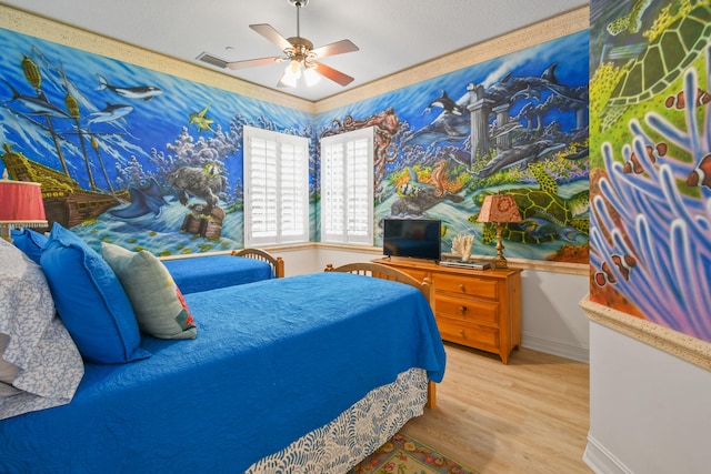 bedroom featuring hardwood / wood-style floors and ceiling fan