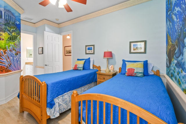 bedroom with ceiling fan, ensuite bath, and wood-type flooring