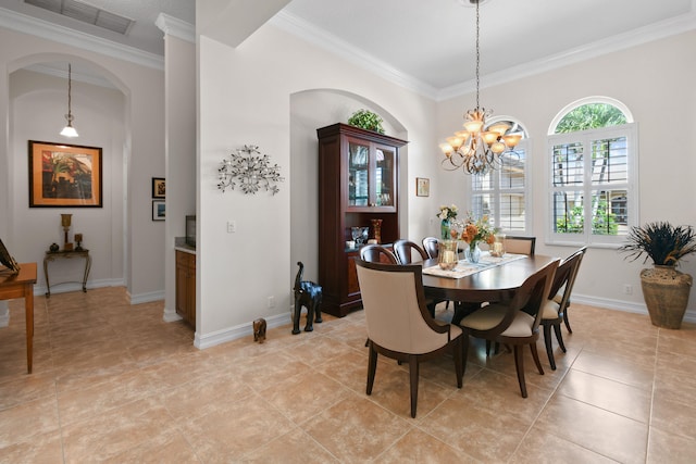 dining room with light tile patterned flooring, crown molding, and an inviting chandelier