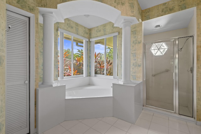 bathroom with tile patterned floors, plus walk in shower, and decorative columns