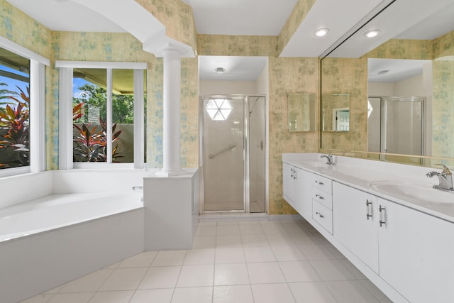 bathroom with vanity, ornate columns, and independent shower and bath