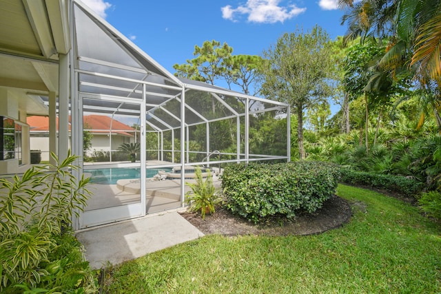 view of yard with a lanai and a patio