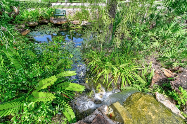 exterior details with a small pond