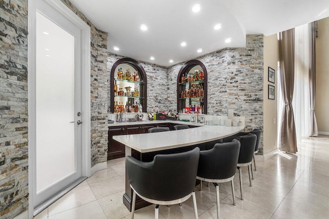 bar with light tile patterned flooring