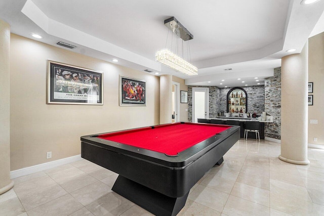 playroom featuring billiards, bar, a tray ceiling, and light tile patterned flooring