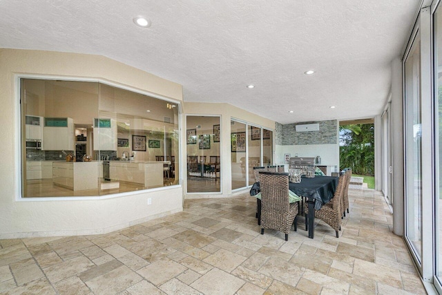 dining area with a textured ceiling