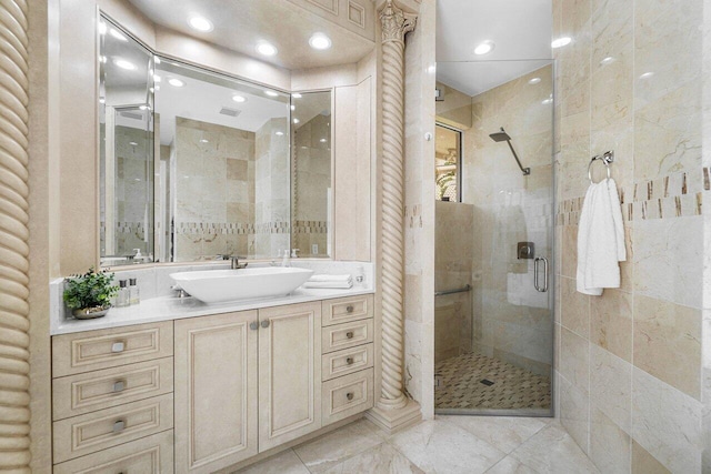 bathroom with vanity and an enclosed shower