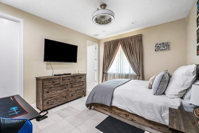 bedroom with light tile patterned flooring