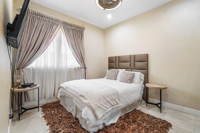 bedroom featuring light tile patterned floors