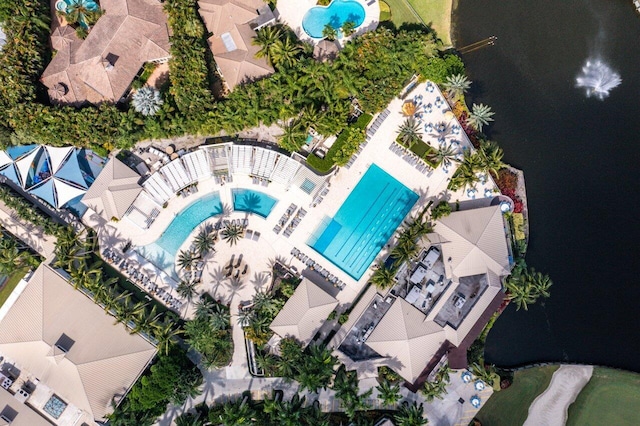 birds eye view of property with a water view