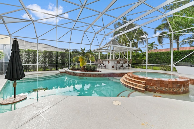 view of pool with an in ground hot tub, a bar, and a lanai