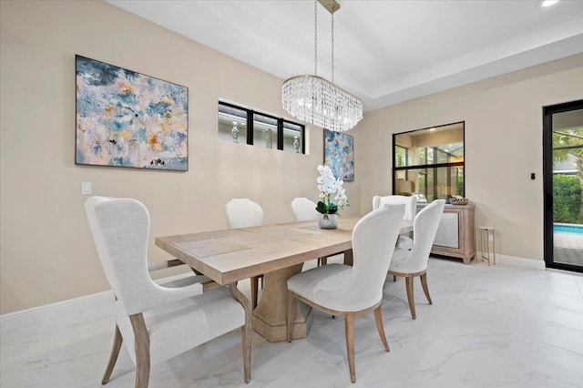 dining space with a chandelier