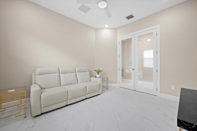 living room featuring french doors and ceiling fan