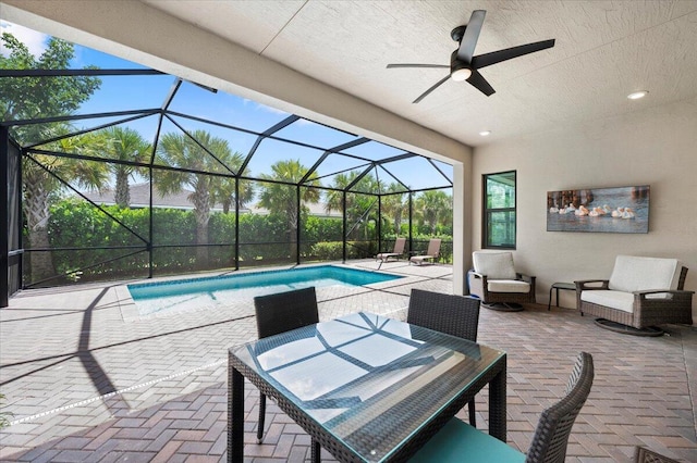 view of patio with a lanai and ceiling fan