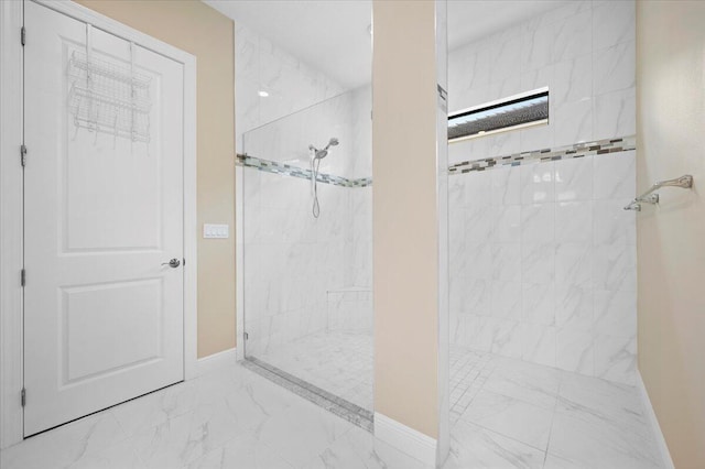 bathroom with a tile shower