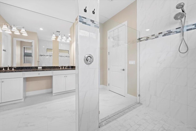 bathroom featuring vanity and tiled shower