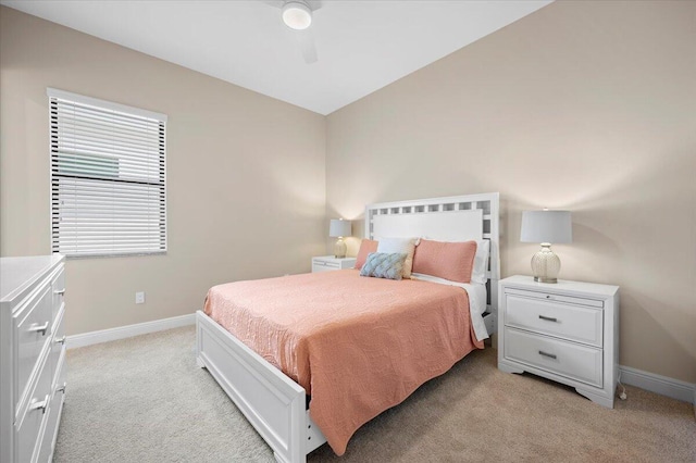 bedroom featuring ceiling fan and light colored carpet