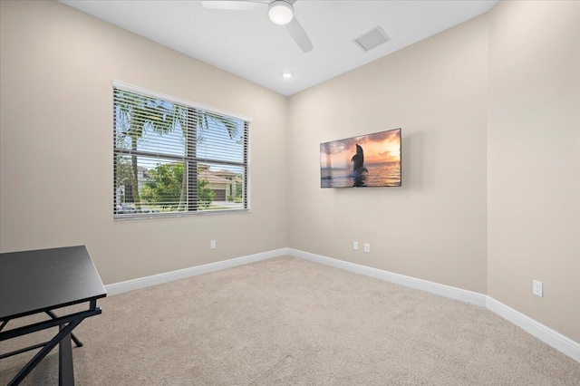 interior space with ceiling fan