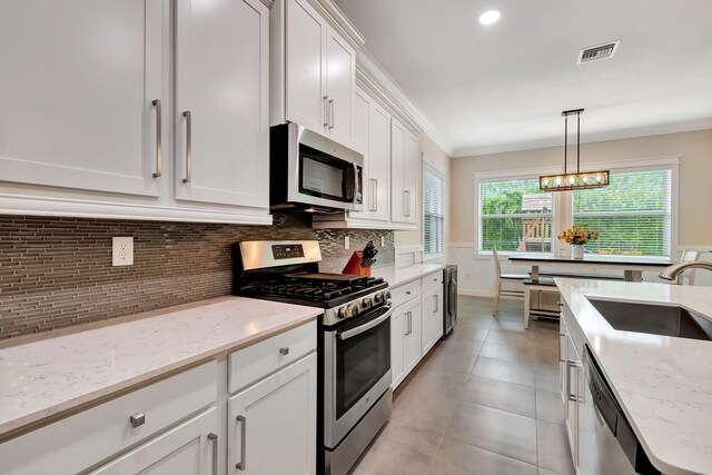 kitchen featuring stainless steel appliances, visible vents, a sink, and white cabinetry