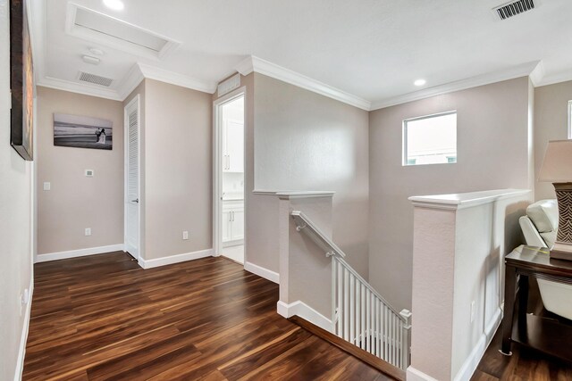 living room with ceiling fan, dark wood-type flooring, visible vents, baseboards, and ornamental molding