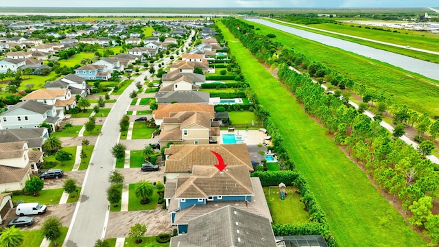 birds eye view of property with a residential view