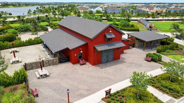 bird's eye view featuring a water view and a residential view