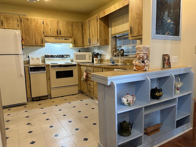 kitchen featuring sink and white appliances