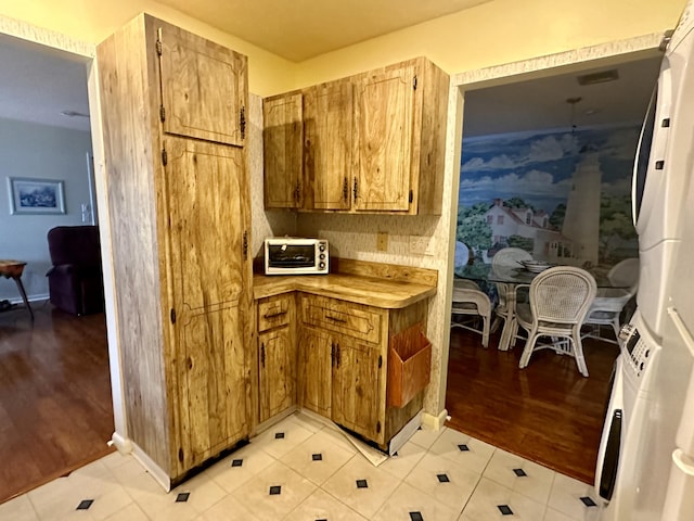 kitchen with white refrigerator and light hardwood / wood-style flooring