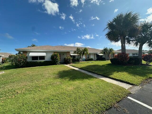 ranch-style home with a front yard