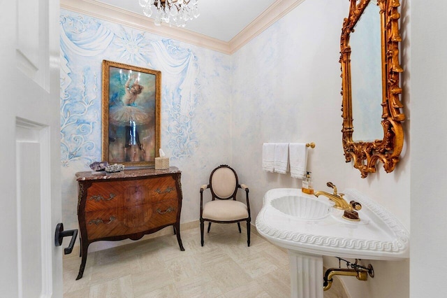 bathroom featuring a sink and crown molding