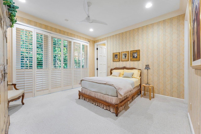 bedroom featuring carpet floors, crown molding, recessed lighting, baseboards, and wallpapered walls