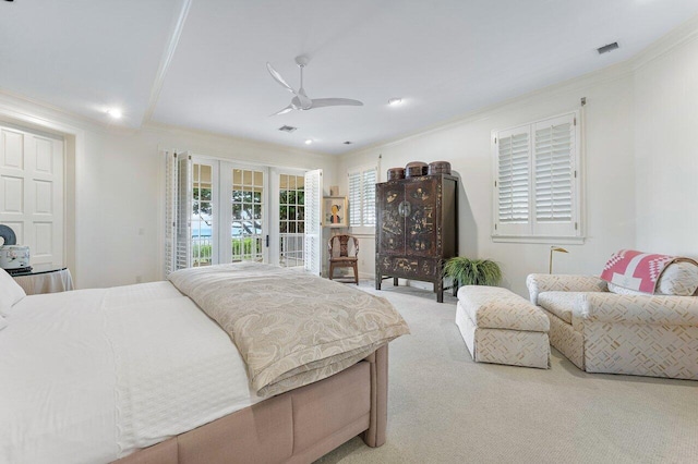 carpeted bedroom featuring access to exterior, visible vents, ornamental molding, and a ceiling fan