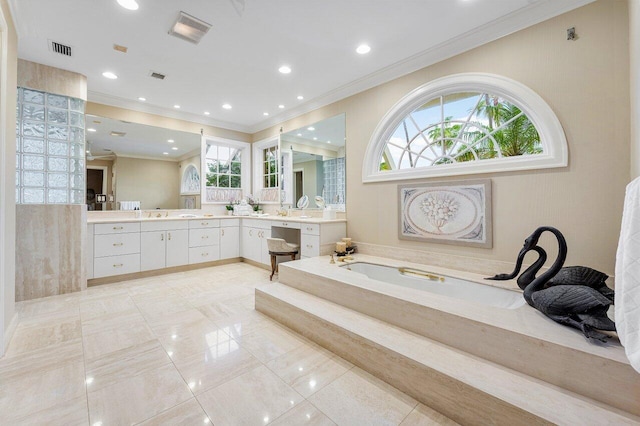 full bath featuring a garden tub, ornamental molding, vanity, and visible vents