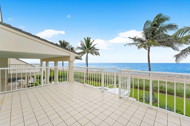 view of patio featuring a water view and a view of the beach