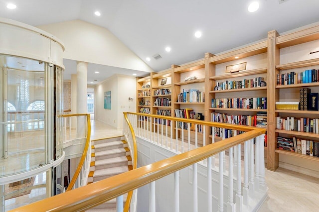 hall with recessed lighting, visible vents, vaulted ceiling, and an upstairs landing