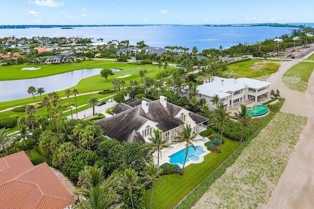 bird's eye view with view of golf course and a water view