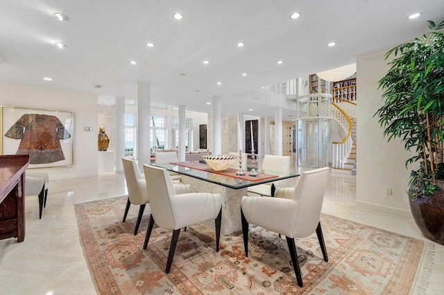 dining area with decorative columns, stairs, baseboards, and recessed lighting