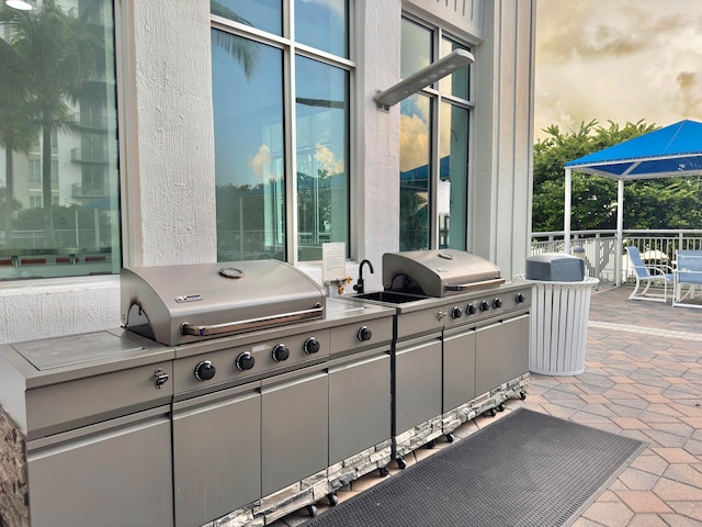 view of patio / terrace with area for grilling and a grill